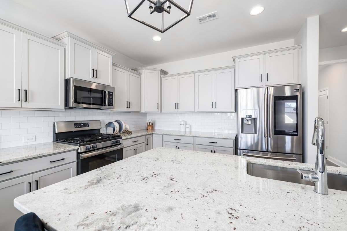 Granite countertop in a kitchen remodel showing natural stone pattern and veining
